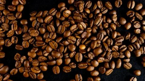 Roasted coffee beans creating natural background texture Stock Photos