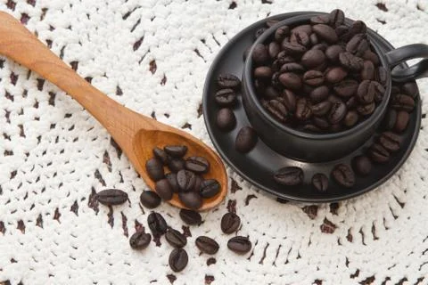 Roasted coffee beans in a cup Stock Photos