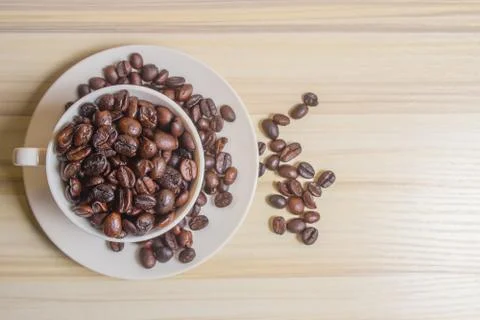 Roasted coffee beans in cup Stock Photos