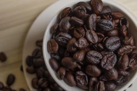 Roasted coffee beans in cup Stock-Fotos