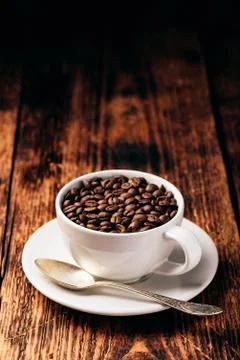 Roasted coffee beans in cup Stock Photos