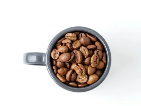 Roasted coffee beans in the cup. Stock Photos