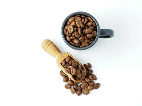 Roasted coffee beans in the cup. Stock Photos