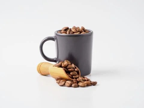 Roasted coffee beans in the cup. Stock Photos