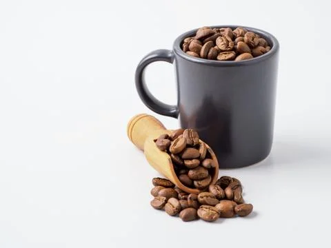 Roasted coffee beans in the cup. Stock Photos