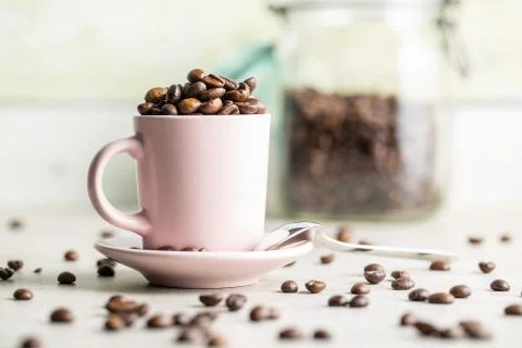 Roasted coffee beans in cup Stockfoto's