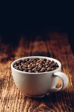 Roasted coffee beans in cup Stock Photos