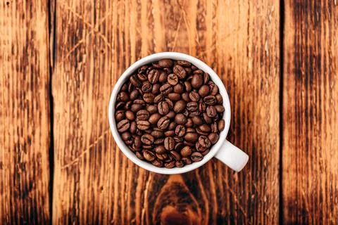 Roasted coffee beans in cup Stock Photos