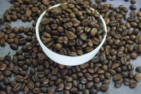 Roasted coffee beans in a cup Stock Photos
