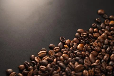 Roasted Coffee Beans on Dark Surface 스톡 사진