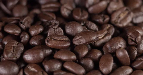 Roasted coffee beans dolly shot. Aromatic coffee beans move slowly. Slide slow Stock Footage 170667154