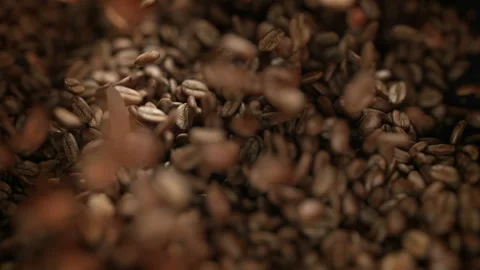 Roasted coffee beans exploding in slow motion 4K Stock Footage 164303627