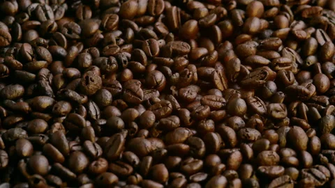 Roasted Coffee Beans falling is background. Organic coffee seeds. Stock Footage 157085445