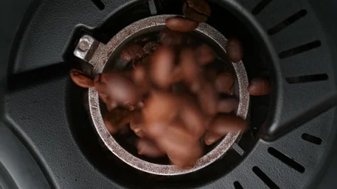 Roasted Coffee Beans Falling into the Burr Coffee Grinder - Top View Stock Footage