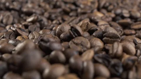 Roasted coffee beans falling down. Slow motion. Close-up shot Stock Footage 82098238