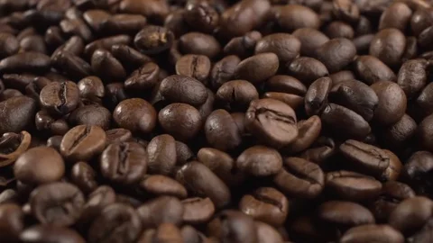 Roasted coffee beans falling down. Slow motion. Close-up shot Stock Footage 82098742