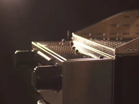 Roasted coffee beans falling into espresso machine Stock Footage 73683685