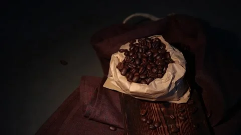 Roasted coffee beans falling Stock Footage 134304157