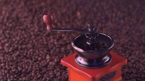Roasted coffee beans falling into hand grinder. Stock Footage 82073564
