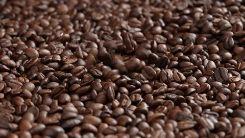 Roasted Coffee beans falling into Pile of coffee beans. Stock Footage 177539196