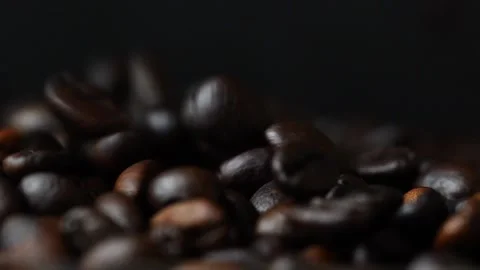 Roasted coffee beans falling in slow motion Stock Footage 277678657