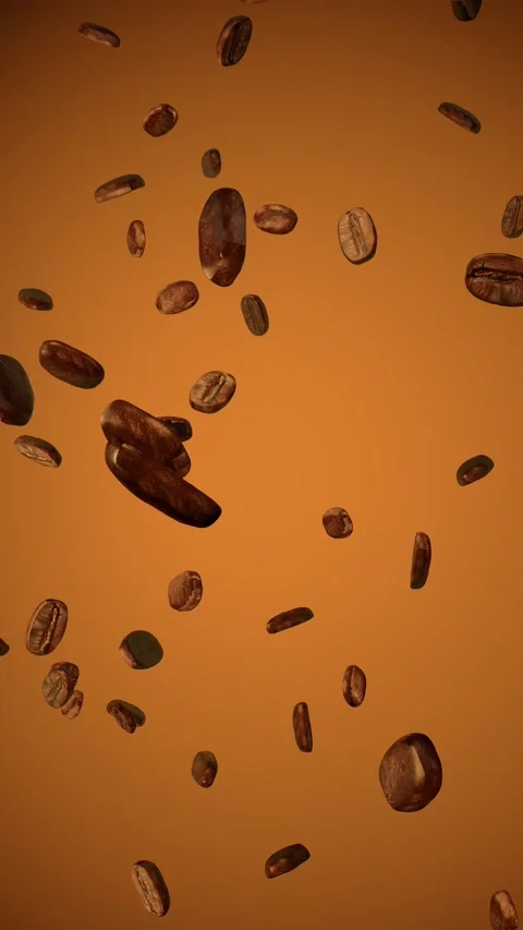 Roasted coffee beans falling in slow motion against a warm amber Stock Footage 346324025