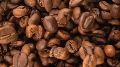 Roasted coffee beans falling in super slow motion macro top view Stock Footage 344848284