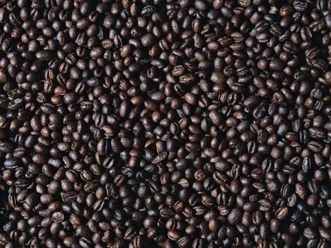 Roasted coffee beans on a flat background. 스톡 사진