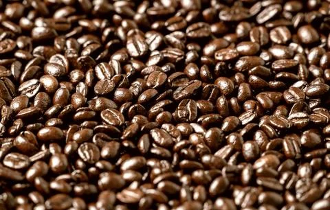 Roasted coffee beans on a flat background Stock Photos