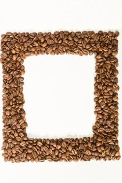 Roasted coffee beans  frame over white background with space  for text or ima Stock Photos