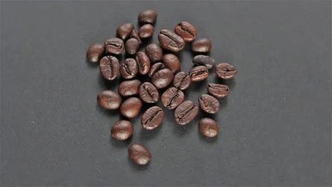Roasted coffee beans on grey background seamless rotating Stock Footage 80353848