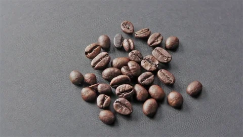 Roasted coffee beans on grey background seamless rotating Stock Footage 80354046