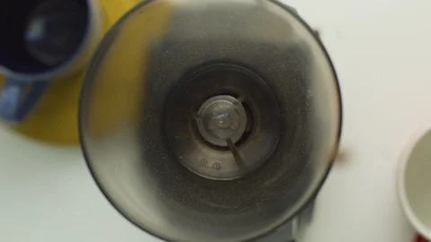 Roasted coffee beans grinding in coffee grinder Stock Footage 108902381