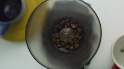 Roasted coffee beans grinding in coffee grinder Stock Footage 108903126
