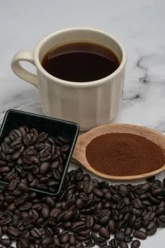 Roasted coffee beans, ground coffee, Cup of coffee, Wooden spoon with roasted Stock Photos