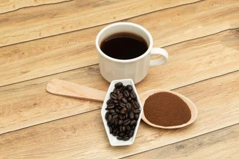 Roasted coffee beans, ground coffee, Cup of coffee, Wooden spoon with roasted Stock Photos