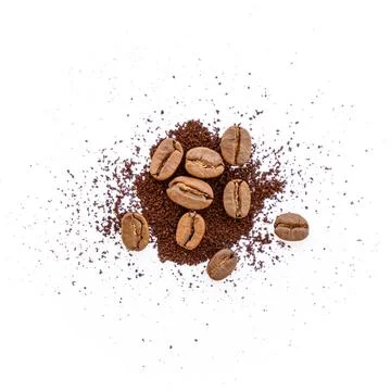Roasted coffee beans with ground coffee on white background Stock Photos
