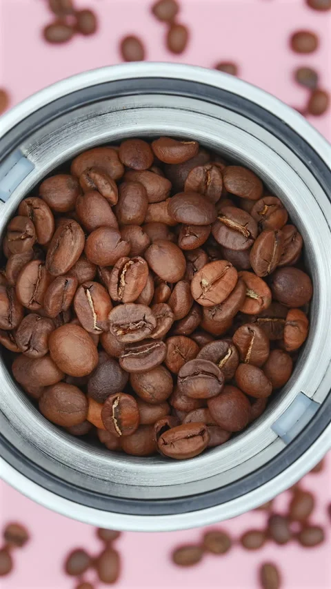 Roasted Coffee Beans Inside A Metal Grinder. Vertical Stock Footage 297089997