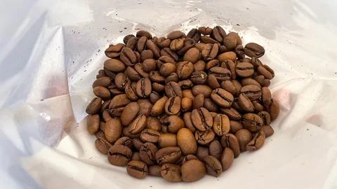 Roasted Coffee Beans Inside White Coffee Bag Stock Photos