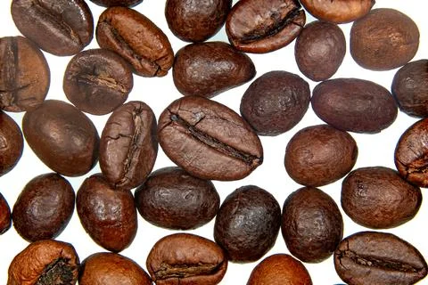 Roasted coffee beans isolated on the background in the composition Photos