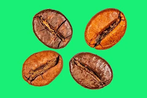 Roasted coffee beans isolated on the background in the composition Stock Photos