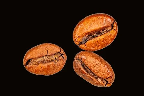 Roasted coffee beans isolated on the background in the composition Stock Photos