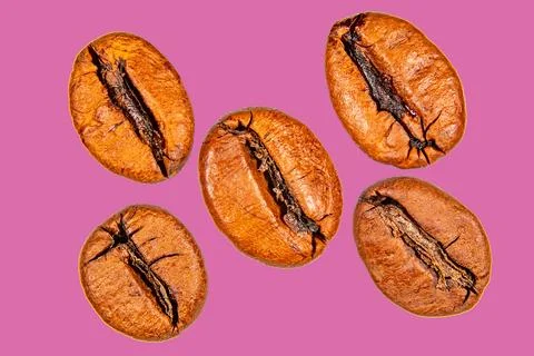 Roasted coffee beans isolated on the background in the composition Stock Photos