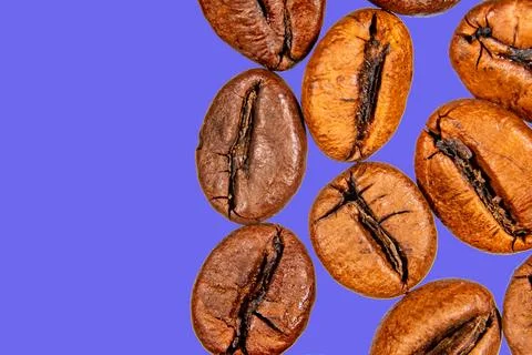 Roasted coffee beans isolated on the background in the composition Stock Photos