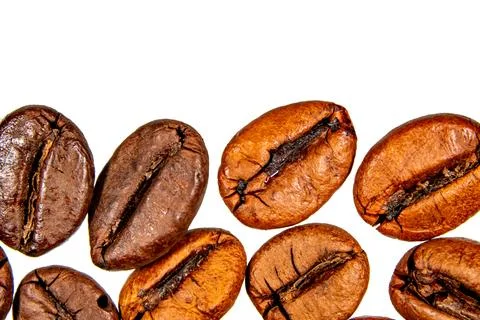 Roasted coffee beans isolated on the background in the composition Stock Photos