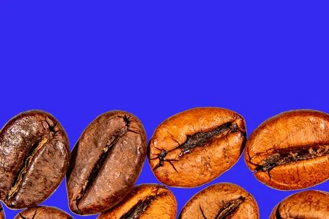 Roasted coffee beans isolated on the background in the composition Stock Photos