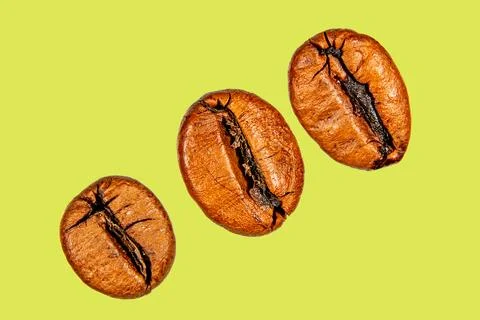 Roasted coffee beans isolated on the background in the composition Photos