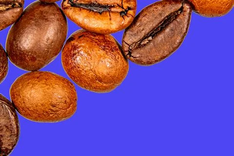 Roasted coffee beans isolated on the background in the composition Stock Photos