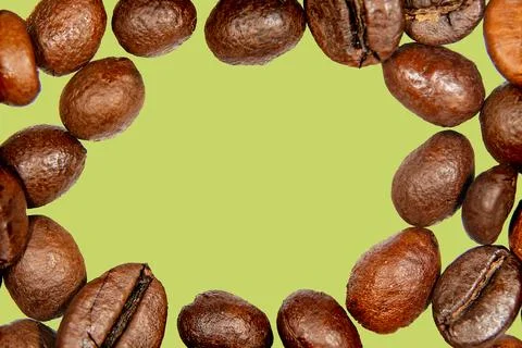 Roasted coffee beans isolated on the background in the composition Stock Photos