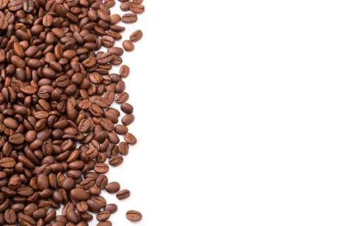 Roasted coffee beans. Isolated on a white background. Stock Photos